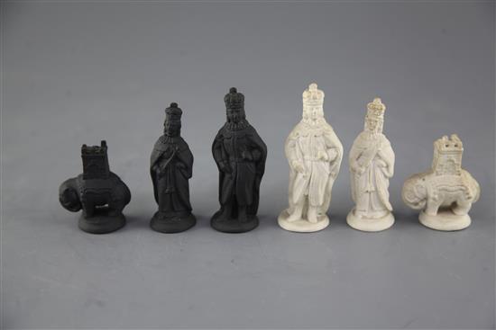 A Castleford type biscuit porcelain and basalt chess set, kings 3.25in.